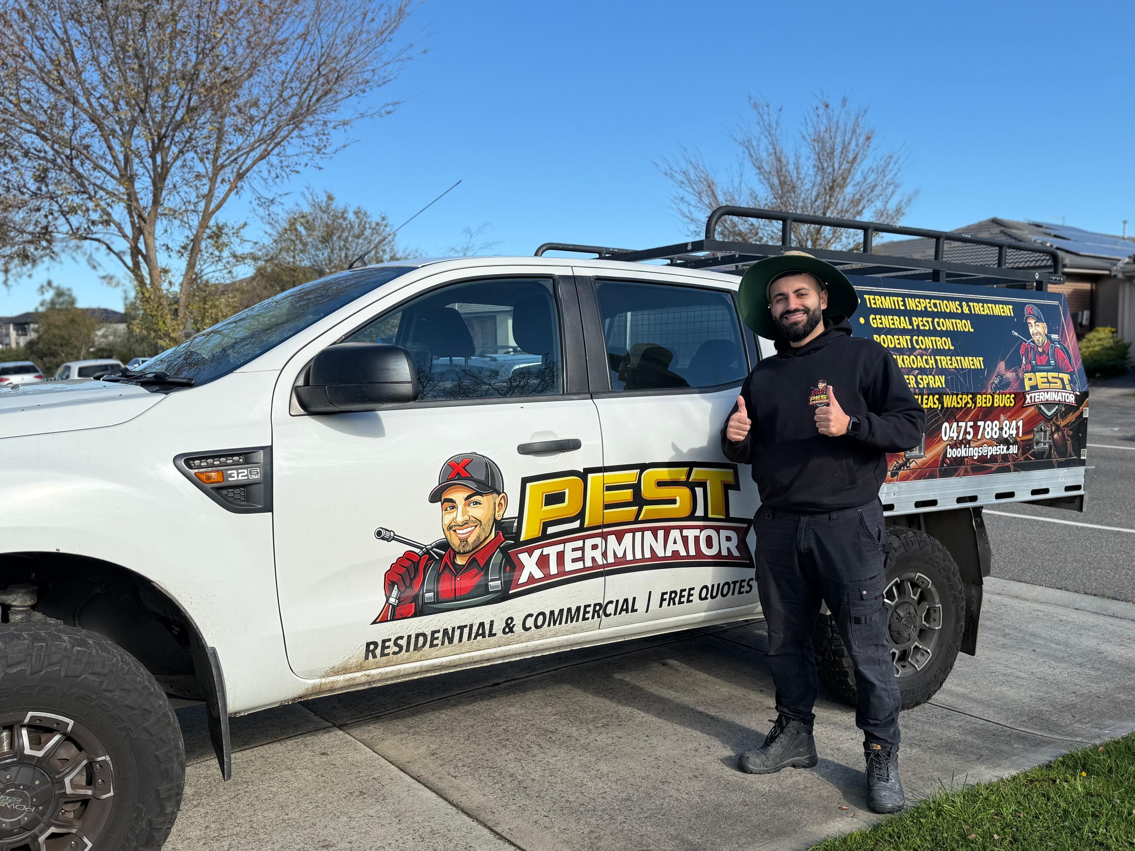 Pest Xterminator technician with branded service van